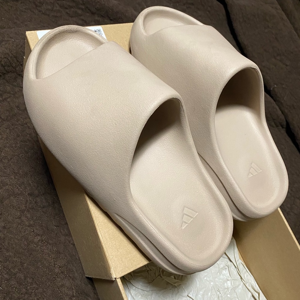 Yeezy Slides in Pure. Size 8 in US Men and fits a size 9 in US Women.